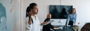 Young businesswoman presenting to a room